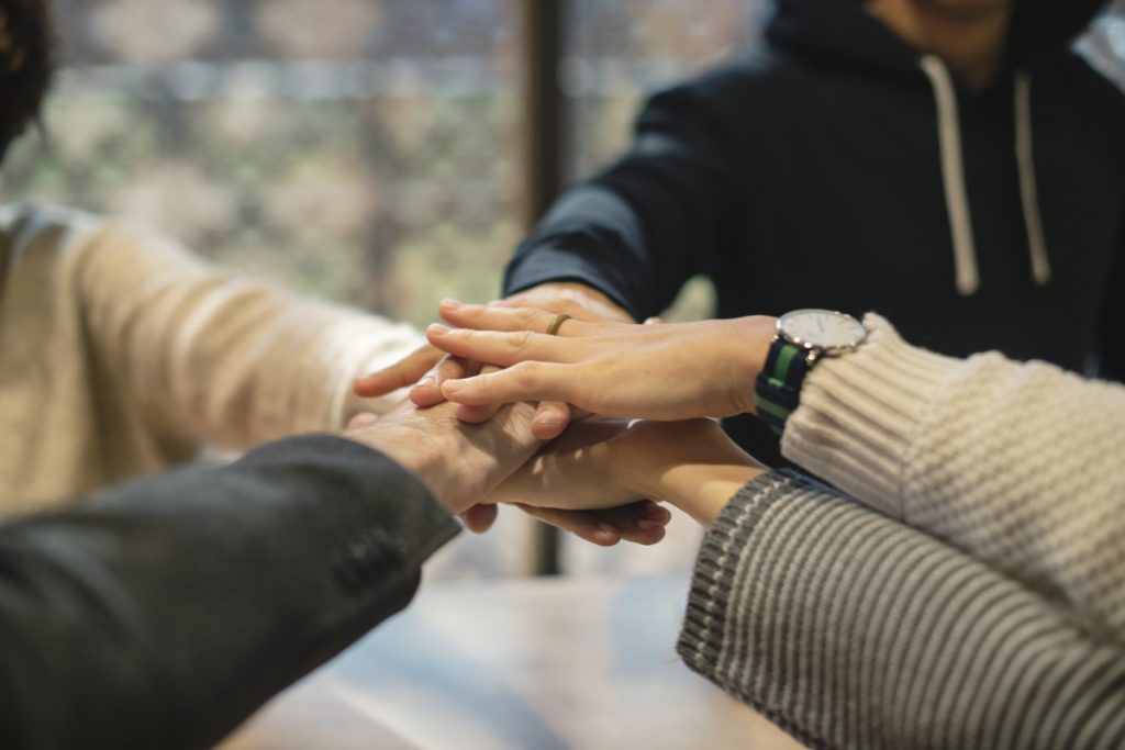 Staff holding hands