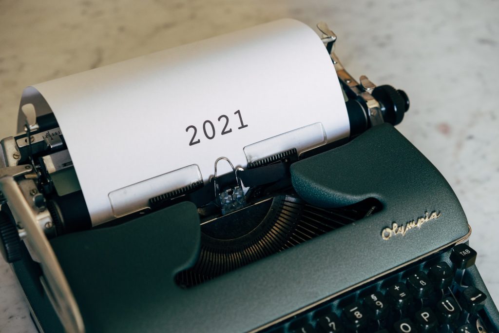 typewriter with a piece of paper that says ‘2021’